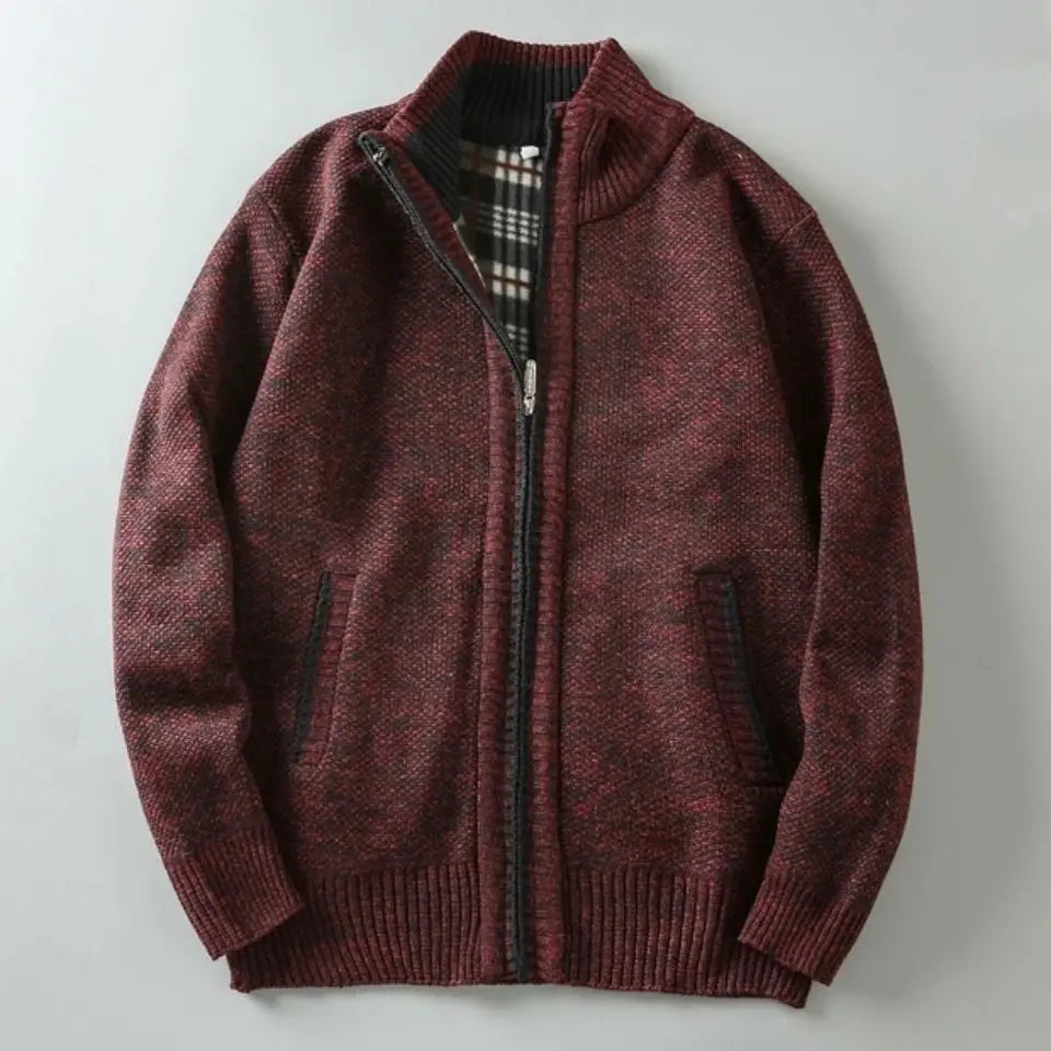 Maroon zip-up sweater on a light gray background