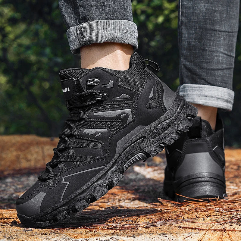 Black tactical boots on a person standing on a wooden surface with a blurred natural background