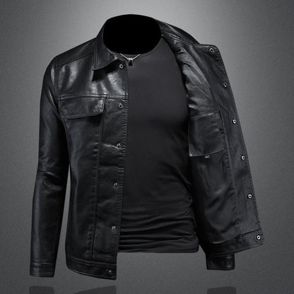 Black leather jacket over a black shirt on a gray background
