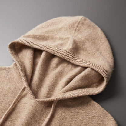 Close-up of a beige hooded garment on a gray background