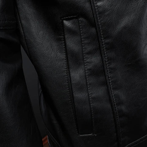 Close-up of a black leather jacket with stitching detail