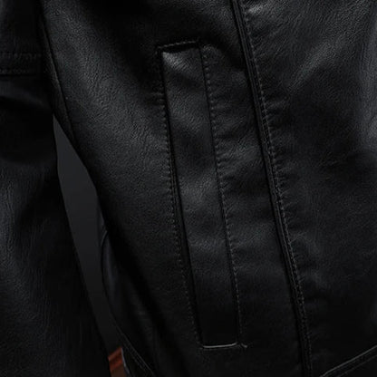 Close-up of a black leather jacket with stitching detail