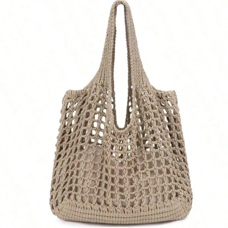 Beige crochet handbag on a white background