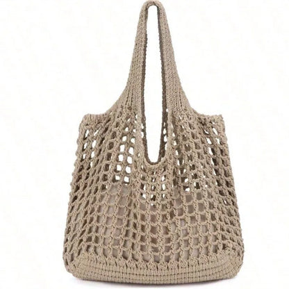 Beige crochet handbag on a white background