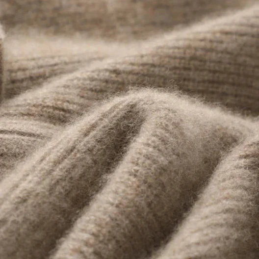 Close-up of textured beige fabric with a ribbed pattern