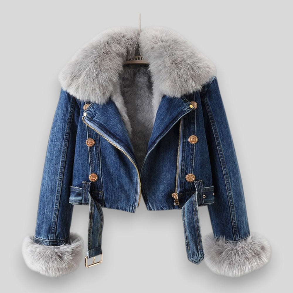 Blue denim jacket with fur trim on a white background