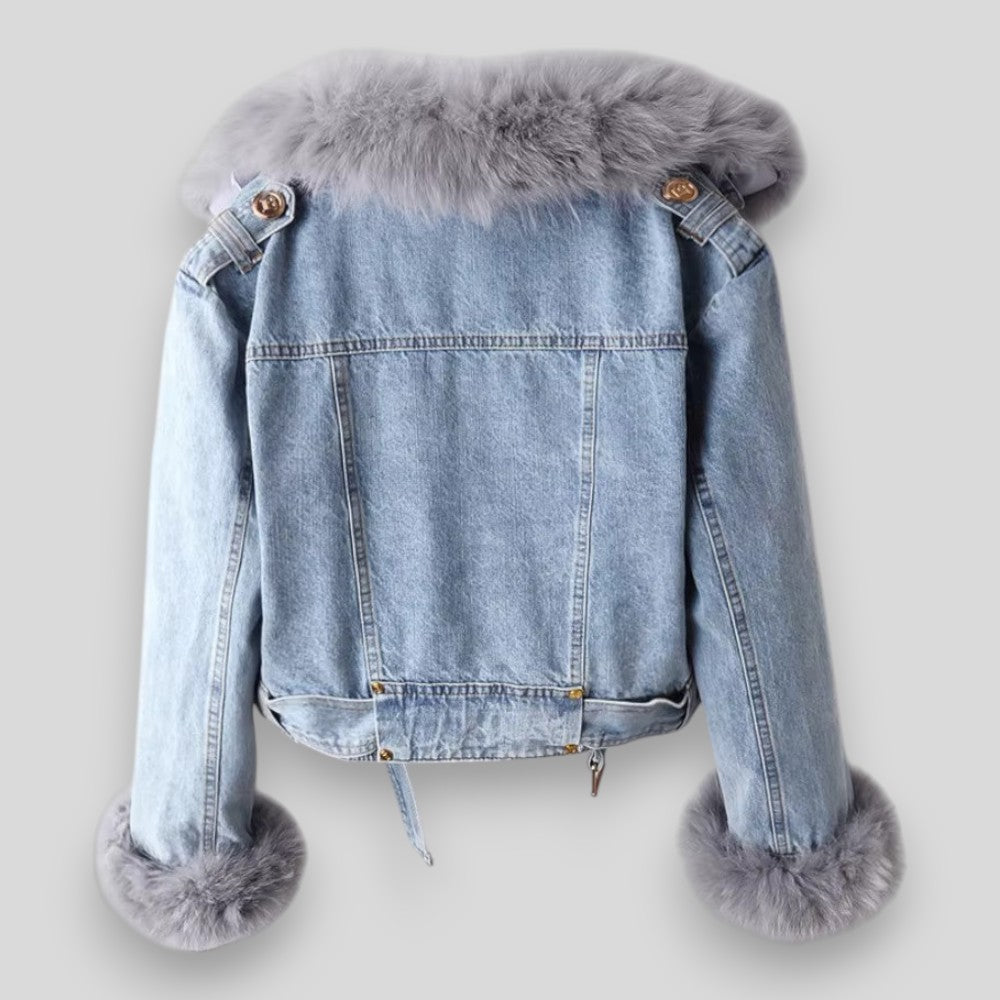 Denim jacket with fur trim on a light gray background