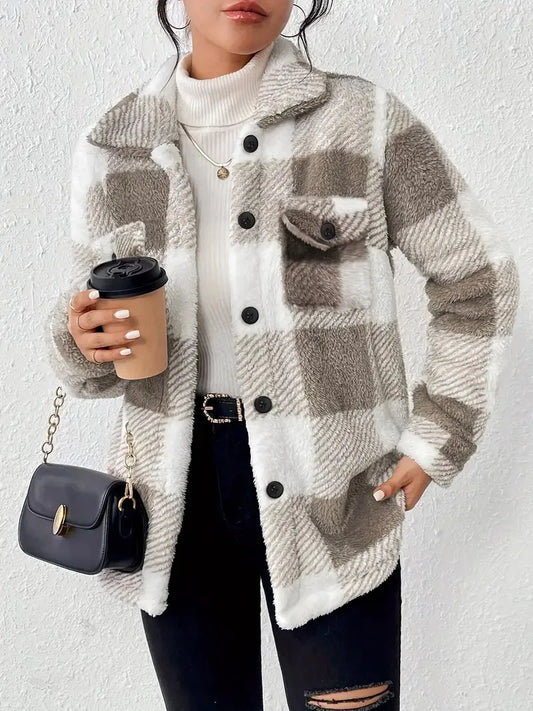 Person wearing a plaid jacket with a white background
