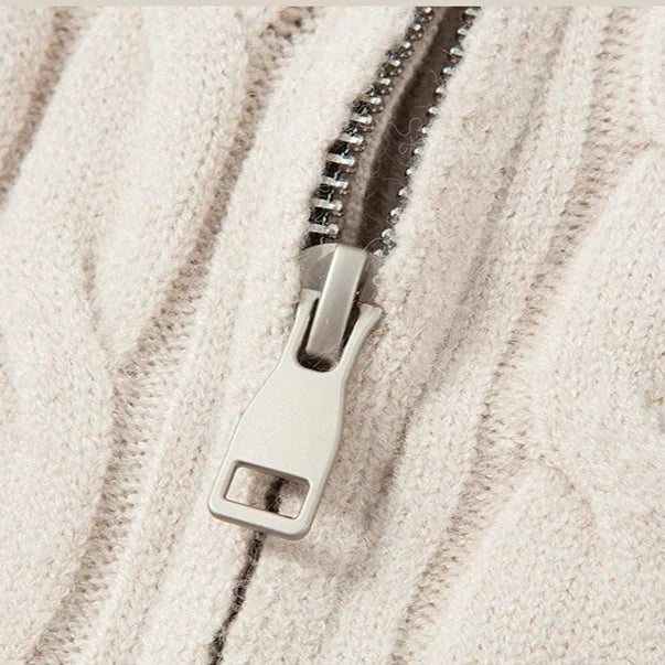 Close-up of a zipper on a textured beige fabric background