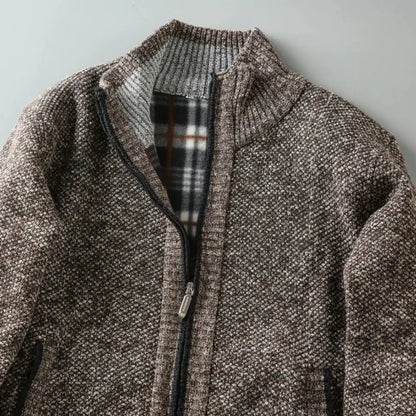 Brown textured jacket with plaid lining on a light gray background