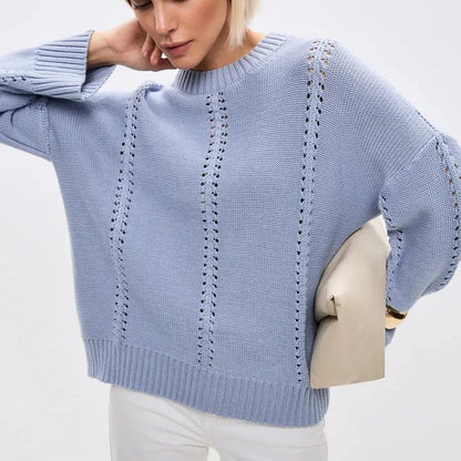 Light blue sweater worn by a person on a white background