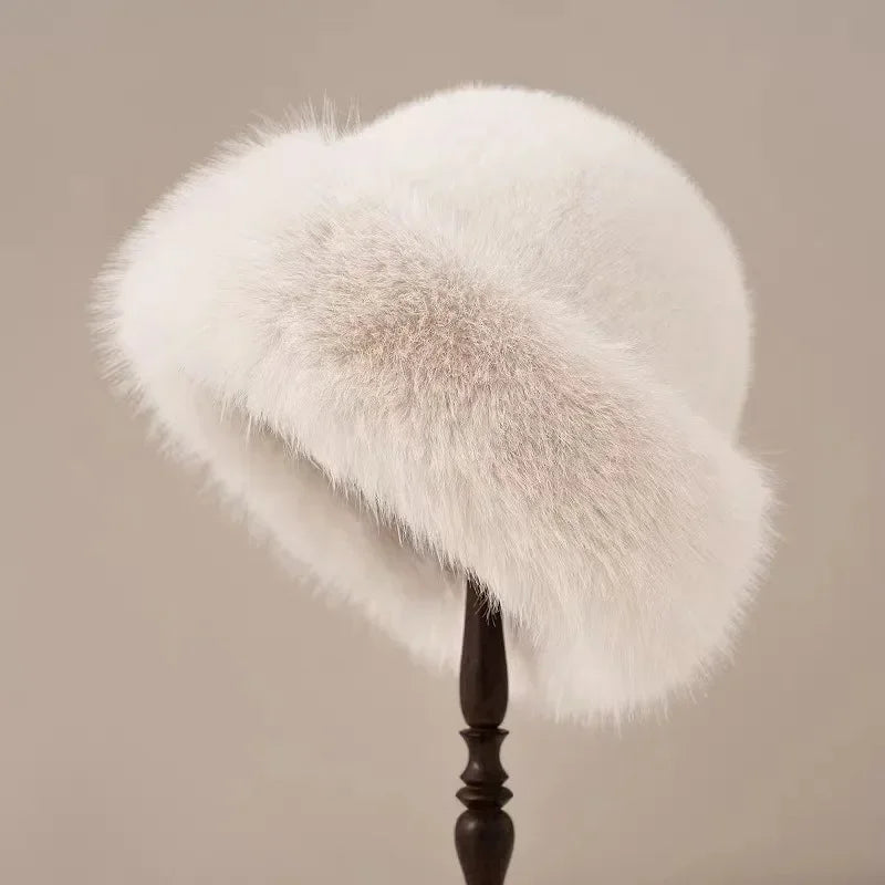 White fur hat on a wooden stand against a beige background