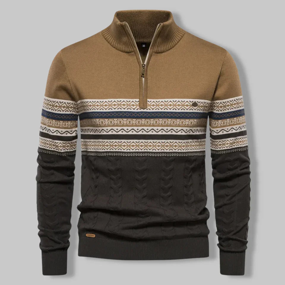 Brown and black sweater with patterned sleeves on a gray background