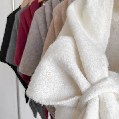 Close-up of a white textured fabric with a blurred background