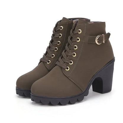 Brown ankle boots with a block heel on a white background