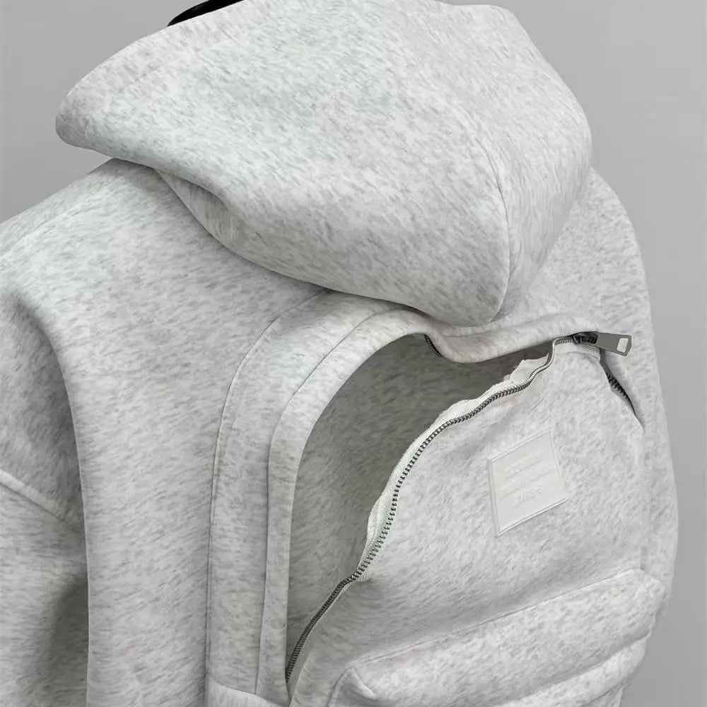 Gray hoodie with a zipper on a gray background