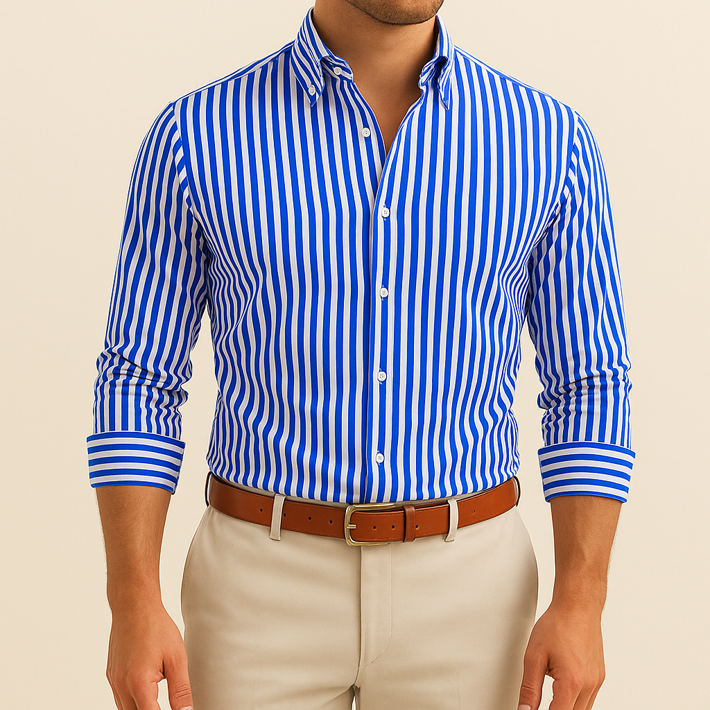 Man wearing a blue and white striped shirt with beige pants on a beige background