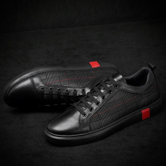 Black leather sneakers with red accents on a dark background