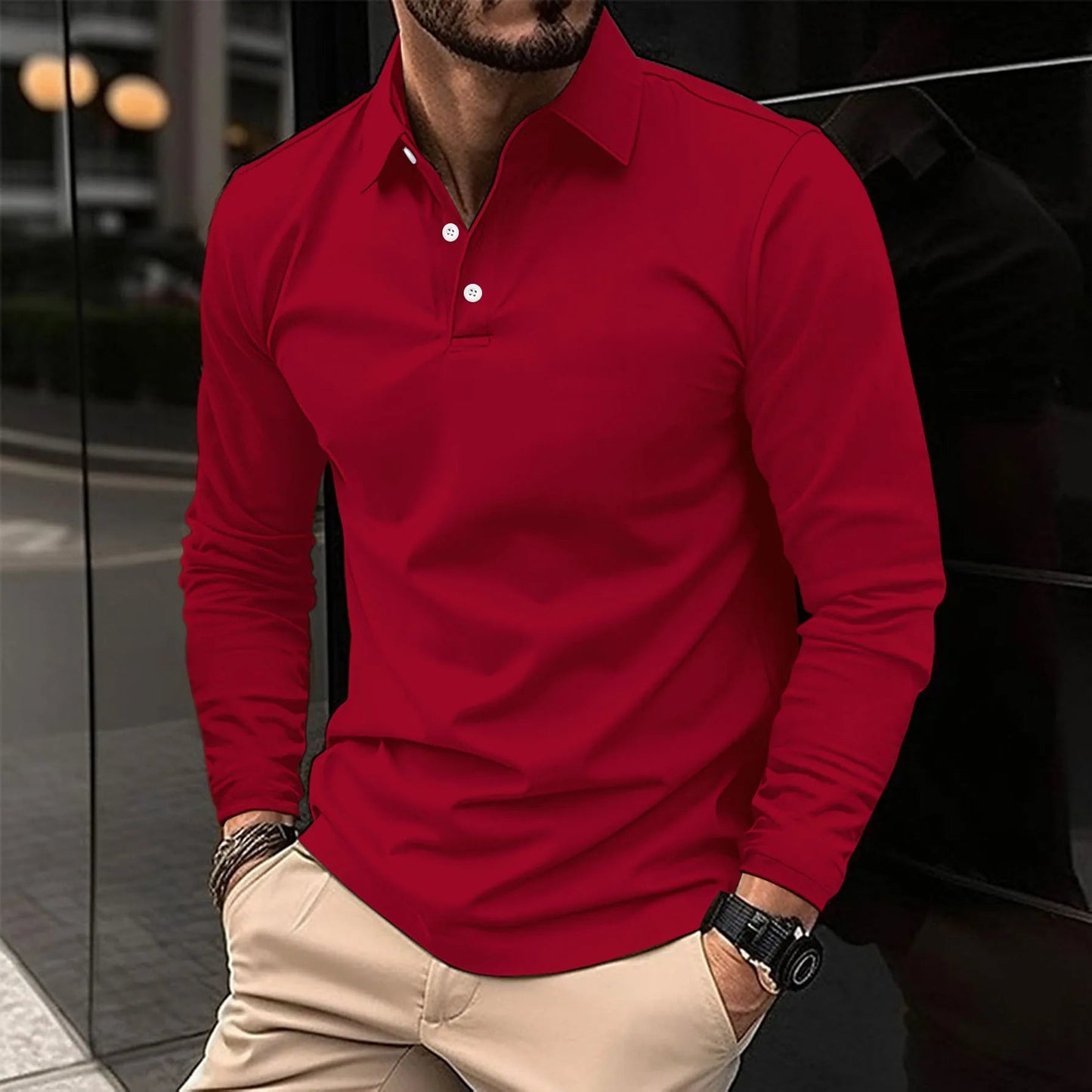 Man wearing a red long-sleeve polo shirt with beige pants.