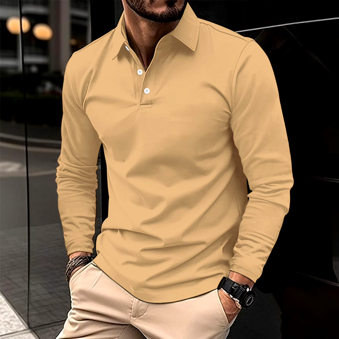 Man wearing a yellow long-sleeve polo shirt with beige pants.