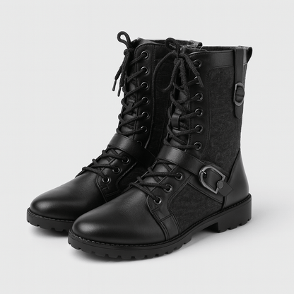 Black leather boots with lace-up design on a light gray background