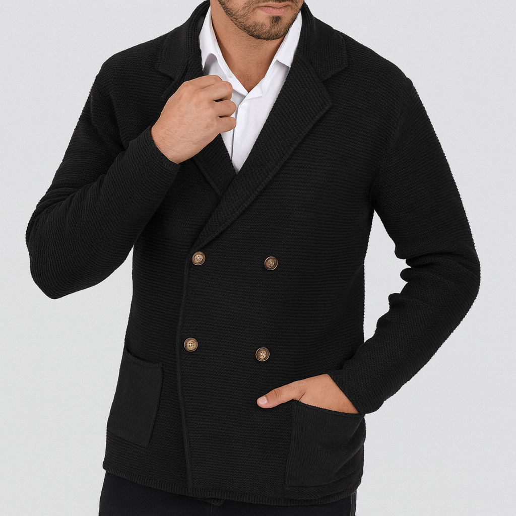 Man wearing a black double-breasted blazer on a light gray background