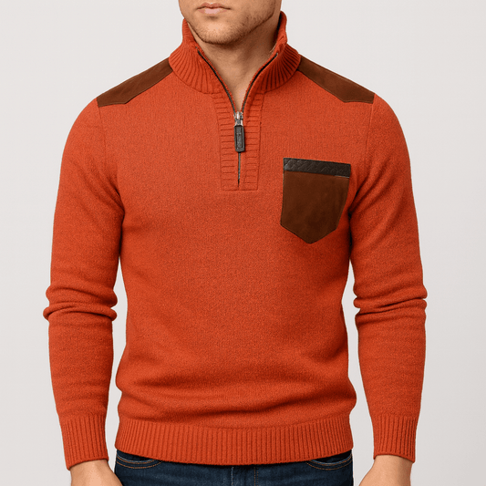 Orange sweater with brown accents on a plain background