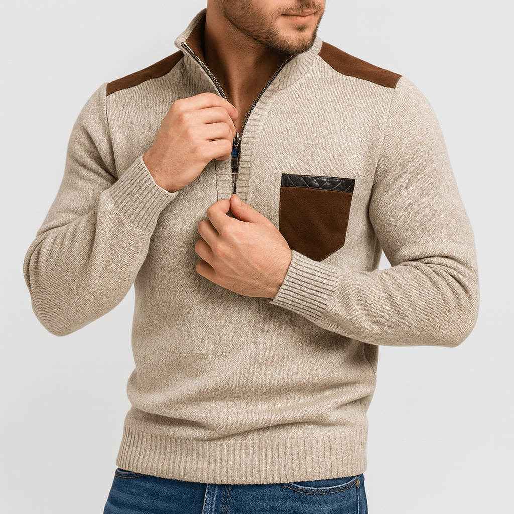 Man wearing a beige sweater with brown accents on a light gray background