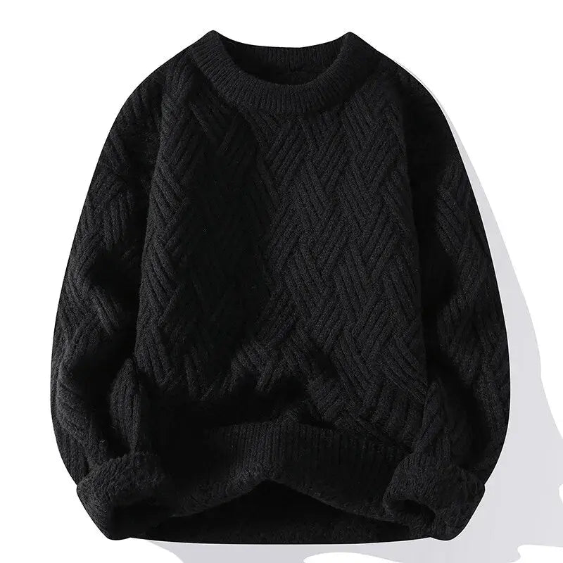 Black cable knit sweater on a white background