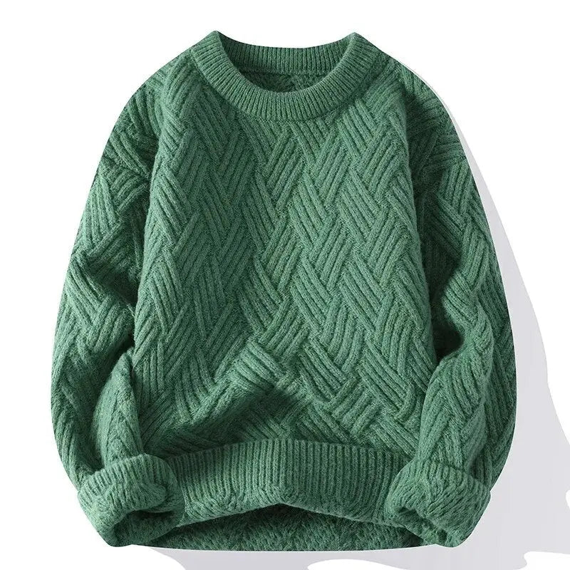 Green sweater with a textured pattern on a white background