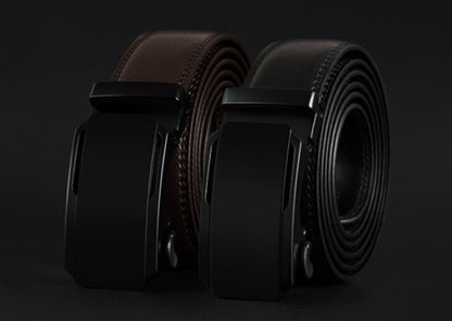 Two black leather belts with a buckle on a dark background