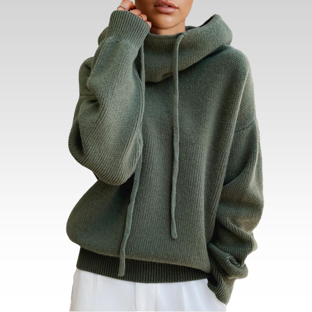 Person wearing a green turtleneck sweater
