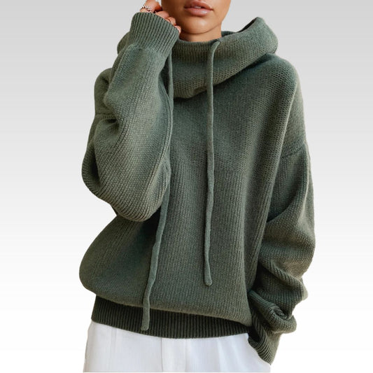 Person wearing a green turtleneck sweater