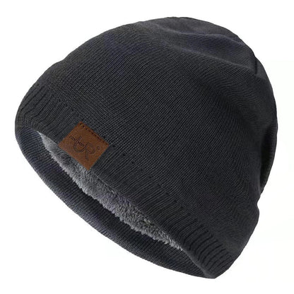Dark gray beanie with a brown leather patch on a white background
