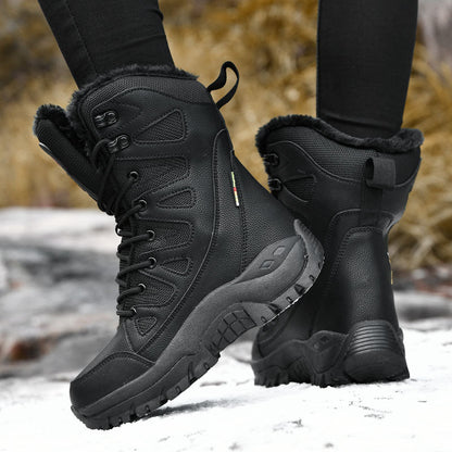 Black winter boots with fur lining worn on a snowy ground.