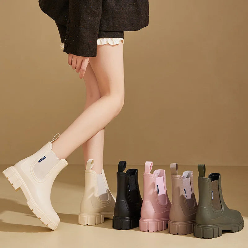 Person wearing white boots with a row of colorful rain boots on a beige background