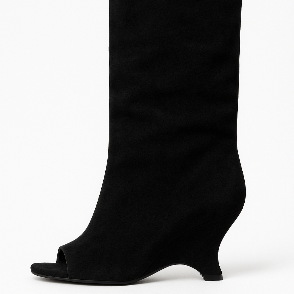 Black knee-high boot on a white background