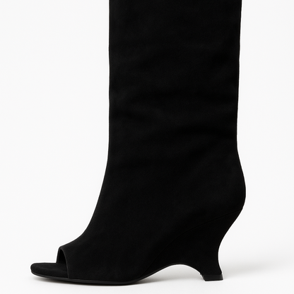 Black knee-high boot on a white background