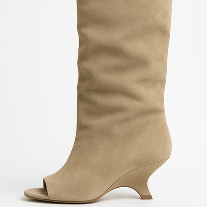Beige knee-high boot on a white background