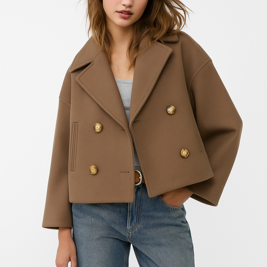 Brown jacket with gold buttons worn by a person on a white background