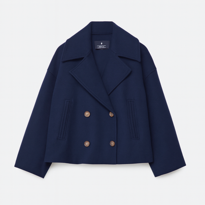 Navy blue jacket with gold buttons on a light gray background