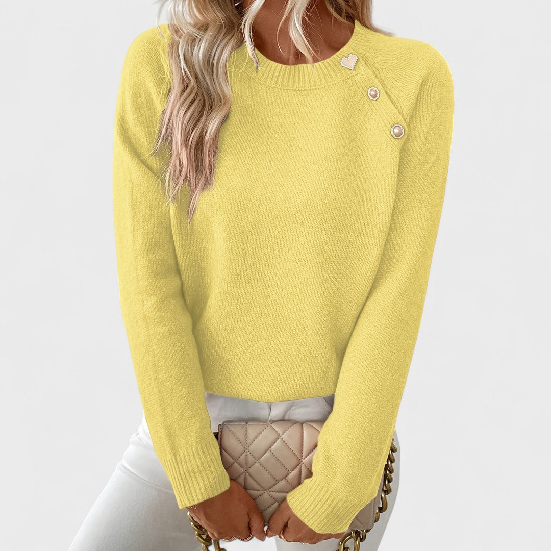 Yellow sweater worn by a person on a white background
