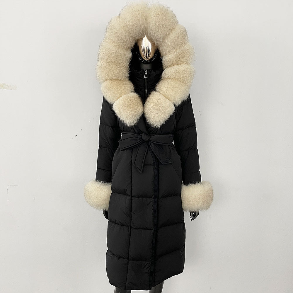 Black puffer coat with beige fur trim on a white background