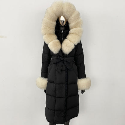 Black puffer coat with beige fur trim on a white background