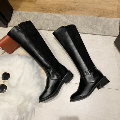 Black knee-high boots on a tiled floor with sunglasses and a wallet nearby.