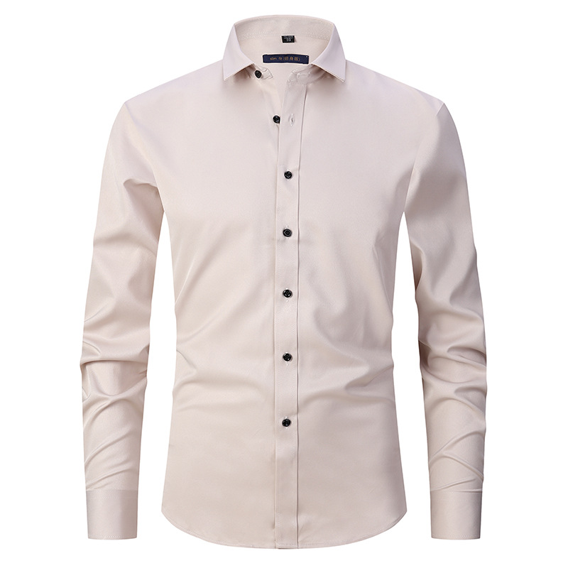 Beige dress shirt with black buttons on a white background