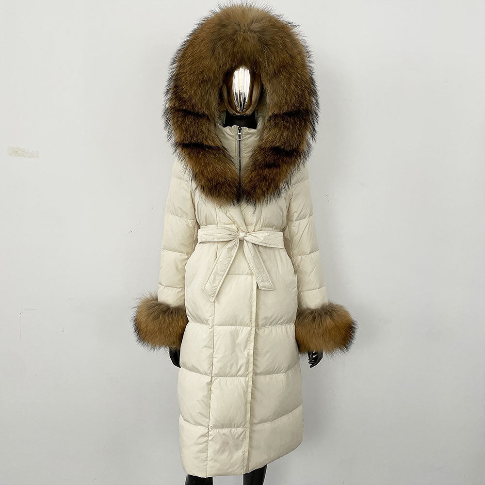 Beige winter coat with fur hood and cuffs on a white background