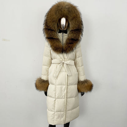Beige winter coat with fur hood and cuffs on a white background