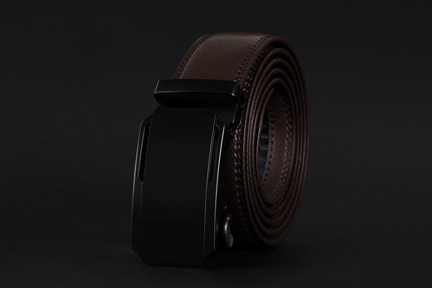 Brown leather belt with black buckle on a dark background