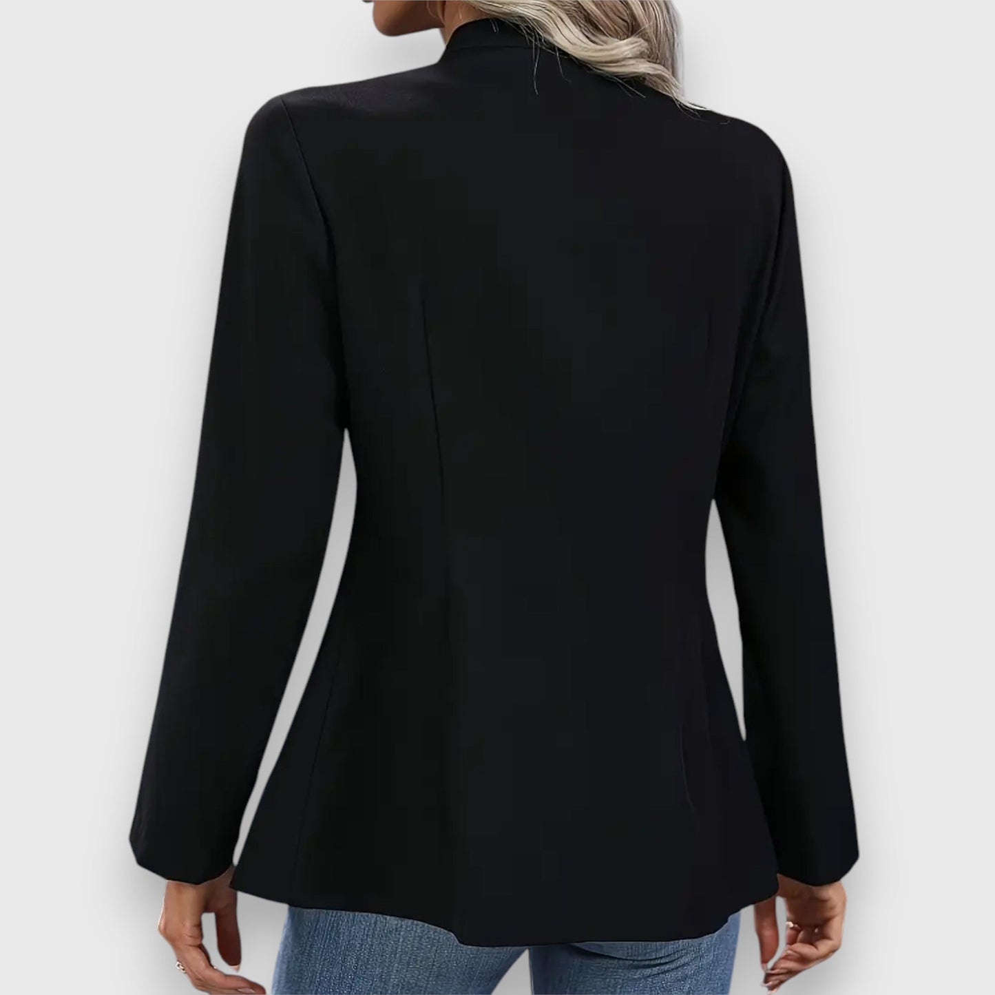 Black blazer worn by a person on a white background